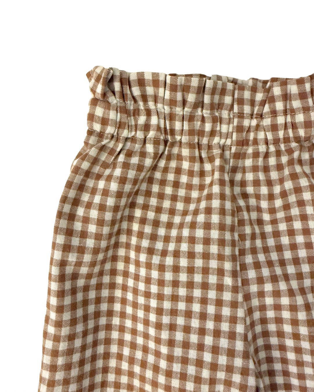 Brown and white checkered gingham pant’s gathered waistband detail on a white background