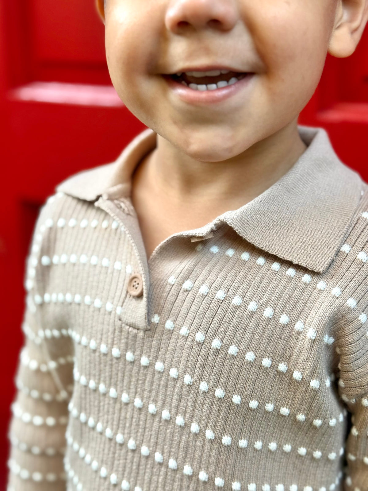 Close-up of an Atelier polo collar and white stitch details