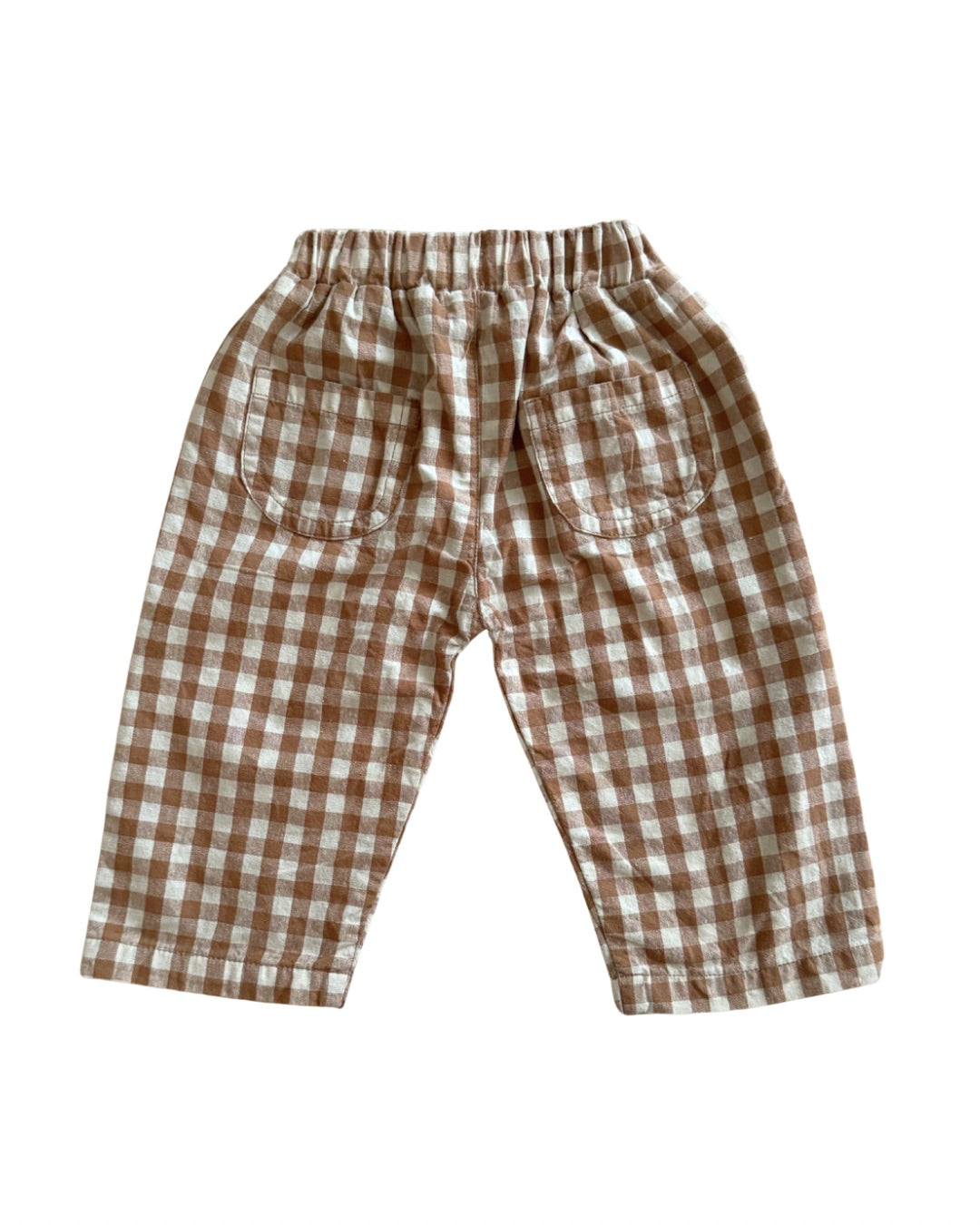 Brown and white checkered pants on a white background
