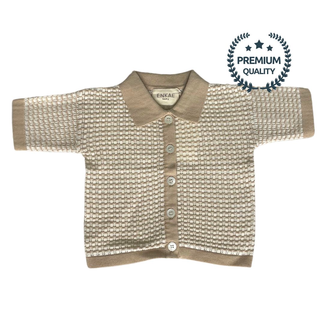 Knitted baby cardigan with collar on a white background, featuring the Enkae brand.