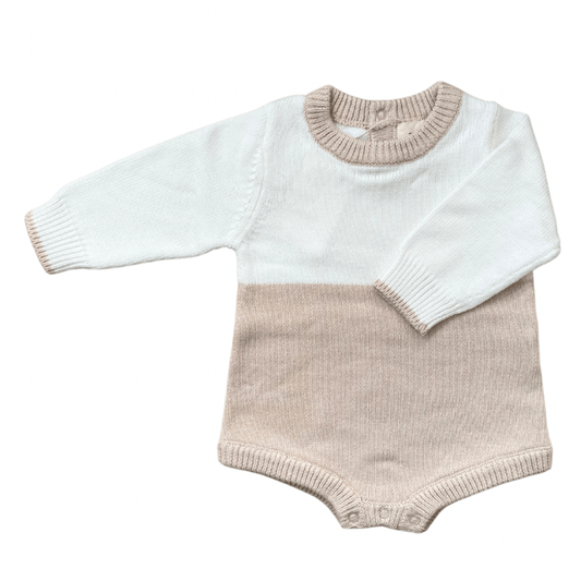 A stylish color block romper in ivory and beige, crafted from 100% premium cotton. Designed with a beige collar and sleeve hems for a subtle contrast, this cozy, oversized fit grows with your little one.