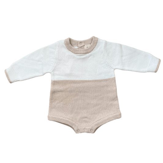 A cozy, gender-neutral color block romper in beige, made from 100% premium cotton. Featuring an oversized fit, snap closures for easy changes, snaps at back for easy dressing, and quality craftsmanship designed to grow with your little one.