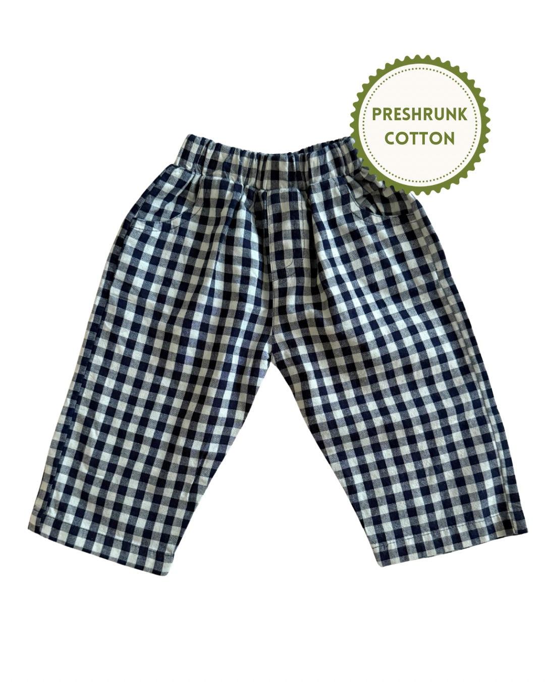 Navy blue and white checkered gingham pants with a 'Preshrunk Cotton' label on a white background