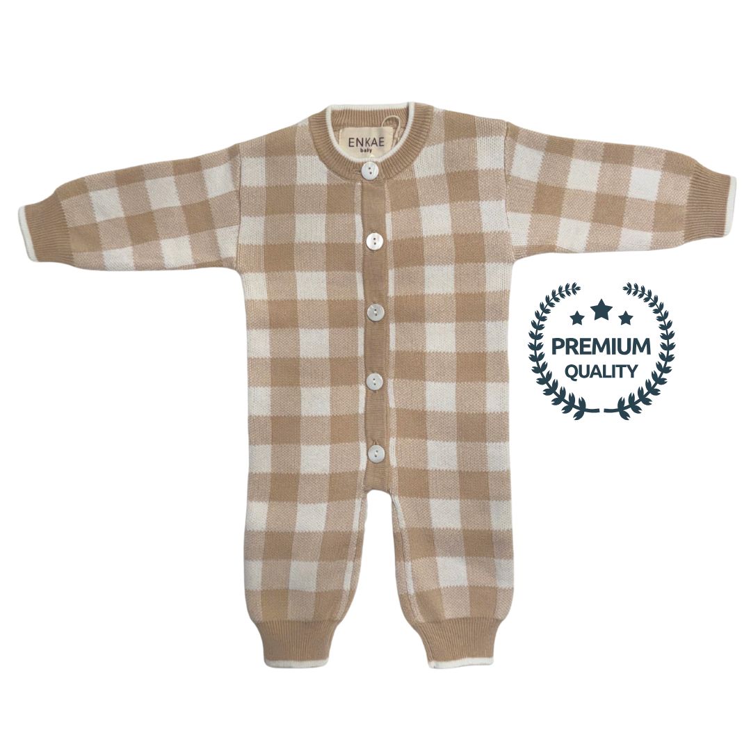Brown and white gingham checkered baby onesie with 'Premium Quality' label on a white background