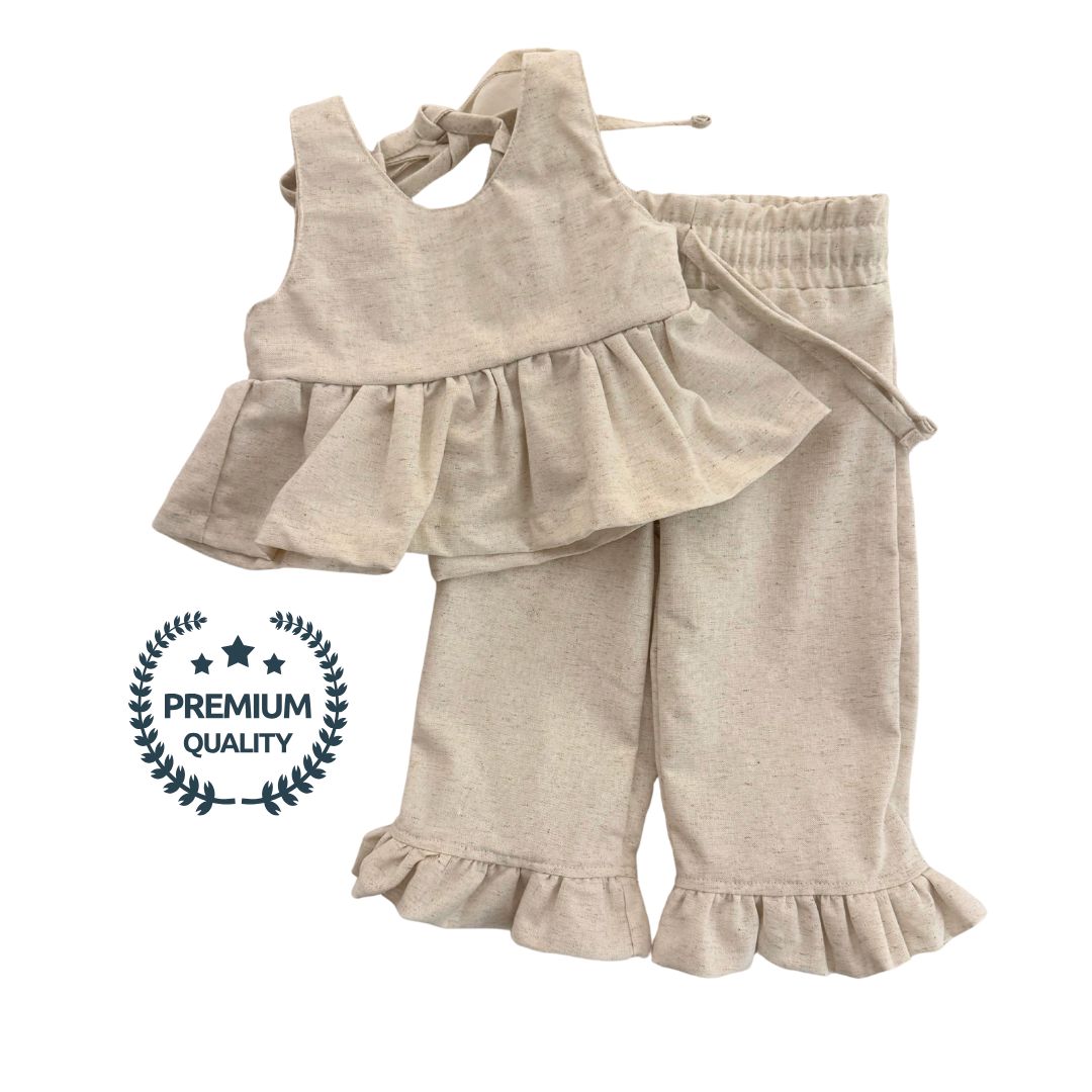 Beige baby outfit with ruffled top and pants on a white background, labeled as premium quality.