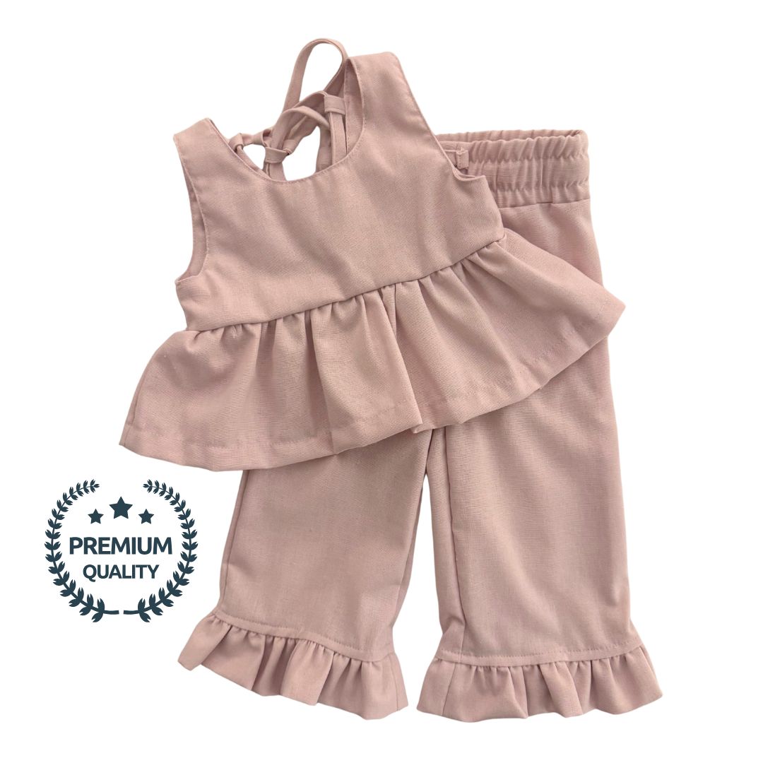 Pink ruffled top and pants set with a 'Premium Quality' label on a white background