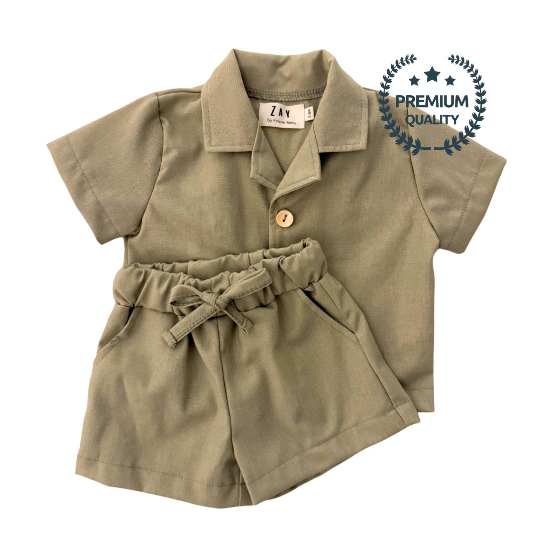 Children's olive green outfit with a shirt and shorts on a white background